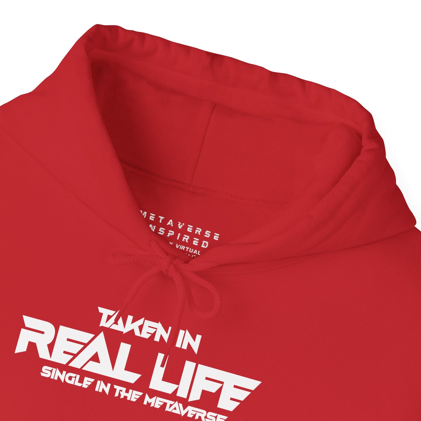 a closeup of the collar of a red colored hoodie with text on front that says taken in real life single in the metaverse by metaverseinspired