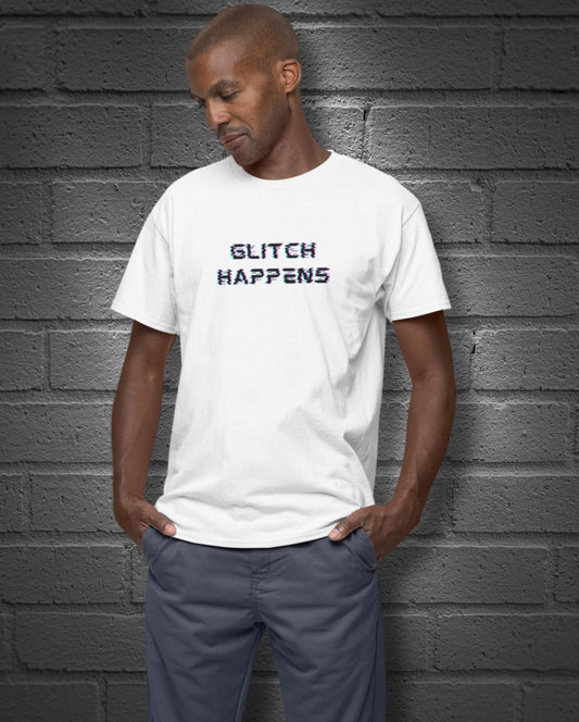Man wearing a white t-shirt with 'GLITCH HAPPENS' text against a gray brick wall.